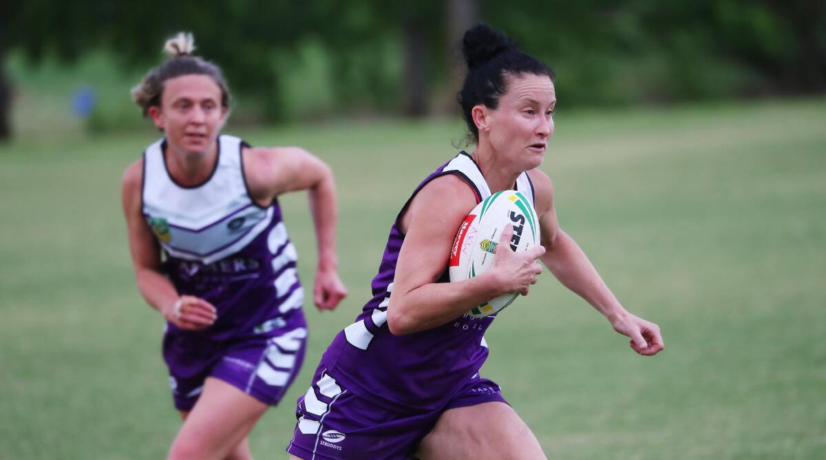 ON THE CHARGE: Rachael Addison (right) storms ahead with Michelle Forrell in support during the women's premier grade competition. A mixed division has been floated for next year's January competition. Picture: Emma Hillier