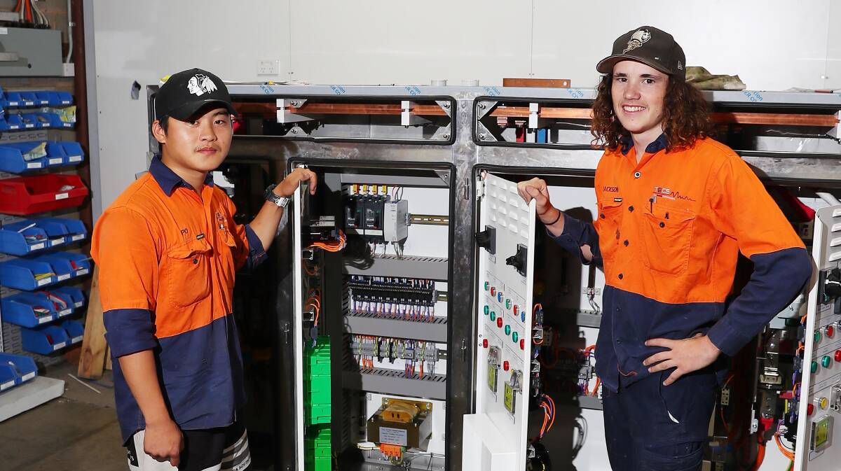 INDUSTRY ADDITION: Apprentice electricians Po Tiwangce and Jackson Kerr are stepping up to fill a state-wide skills shortage. Picture: Kieren L Tilly