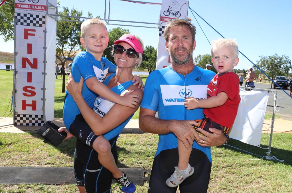 CHEER SQUAD: Angus Westaway (right) with his family, wife Mel and kids Toby (7) and Ky (3) after winning the Temora Triathlon. Picture: Les Smith