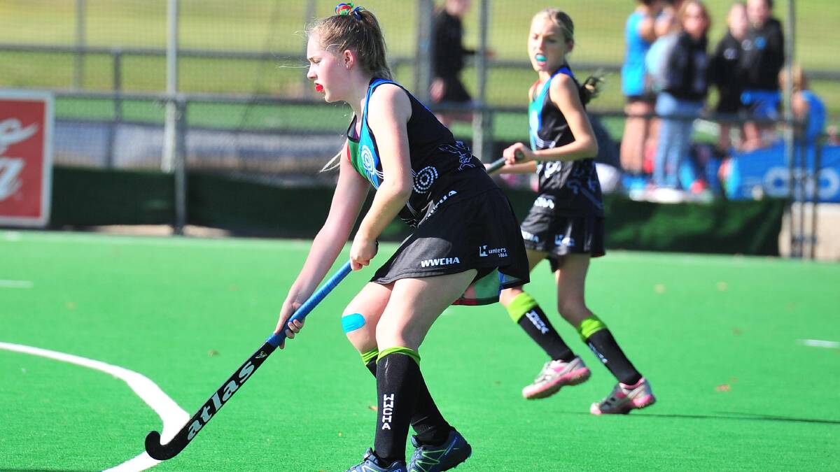 ON THE RISE: Sophie Bailey (left) in action for Wagga at the under 15 state hockey competition in 2017. 