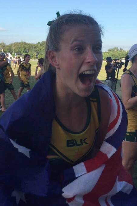 THAT WINNING FEELING: Vienna Randal celebrates after winning the under 20s mixed title at the Youth Touch World Cup in Malaysia last week. Picture: Supplied