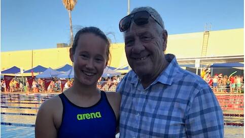 LEGACY: Trinity Cox, 15, with Neville Suitor. Neville is the father of Tracey Suitor, the long-standing record holder who was tragically killed. Wagga High has an annual trophy in her name for the student who breaks the longest standing record.