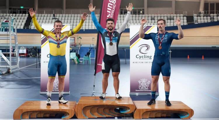 WINNER: Former Wagga cyclist Jamie Green (centre) after taking out the sprint title at Anna Meares Veledrome. 