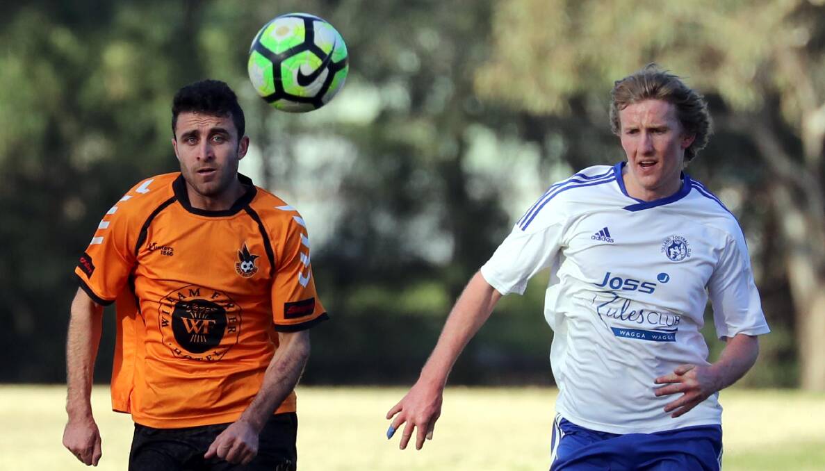 EYES ON THE PRIZE: Wagga United's Nazar Yousif and Tolland's Matthew Kleine charge after the ball during their most recent Pascoe Cup encounter.