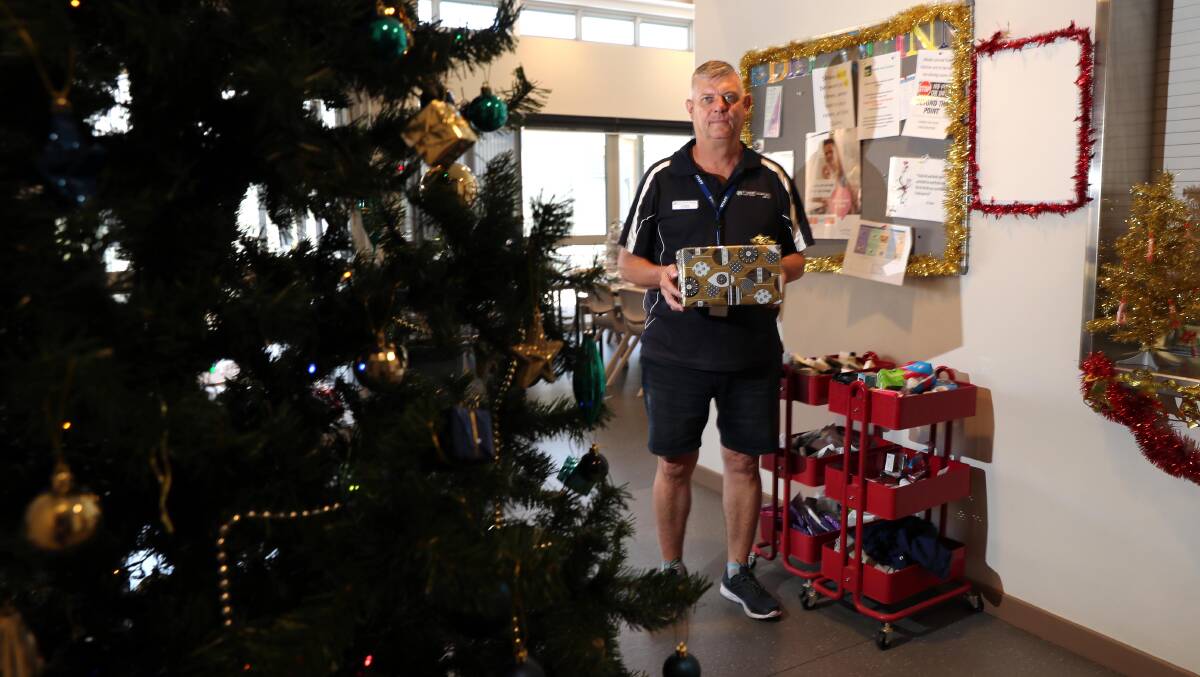 SHARE A GIFT: Case worker Graeme Newcombe is preparing for a busy Christmas. 