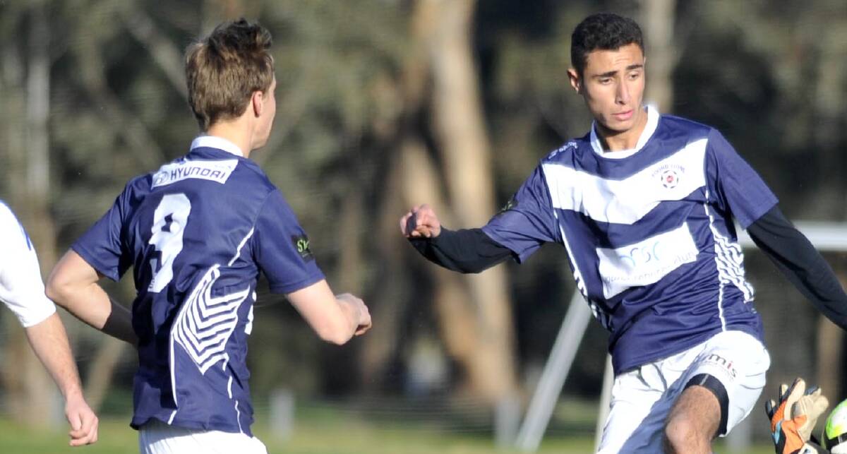LIONS IN ACTION: Milo Dowling and Abdul Arja were among Young's best against Wagga United during Saturday night's 1-all draw. 