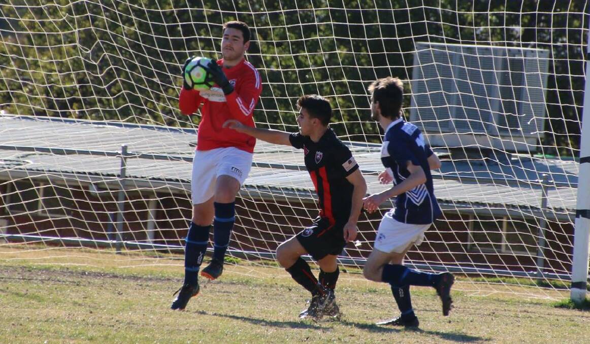 RACE AGAINST TIME: Young goalie Mitch Cameron (left) is pushing to prove his fitness ahead of Sunday's elimination final with Leeton. Picture: Young Lions Soccer Club