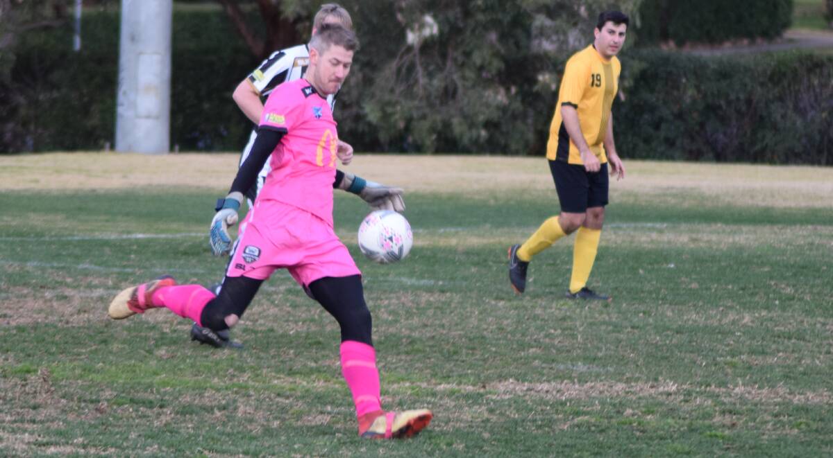 READY TO LAUNCH: Wagga City Wanderers skipper and goalkeeper Rob Fry sends one downtown during his side's epic 2-1 win over Balmain Tigers FC at Gissing Oval. Picture: Supplied