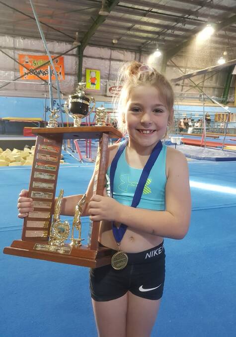HAPPY LANDING: Seven-year-old Zali Tozer took out the level three points championship at the Airborne Gymnastics club championship in Wagga last weekend. Picture: Airborne Gymnastics