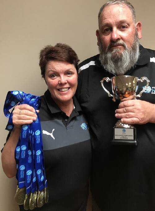 SILVERWARE: Team manager Erin Buik and coach Rod Buik celebrate their Country Championship win. Picture: Contributed
