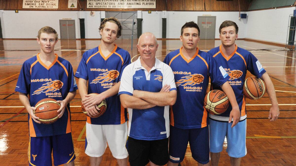 STRONG TIES: Wagga Heat coach John Norman (centre) with Bobby Tye (centre, right) in 2013. Also note the presence of Dom Tye (right) and a young Zac Maloney (left).