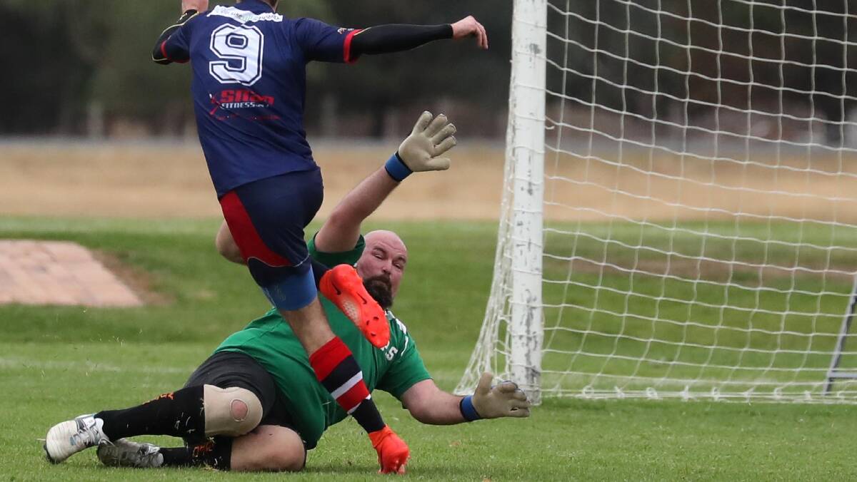 DOWN LOW: Wagga United keeper Andrew McCracken in action against Henwood Park in 2018. Picture: Les Smith