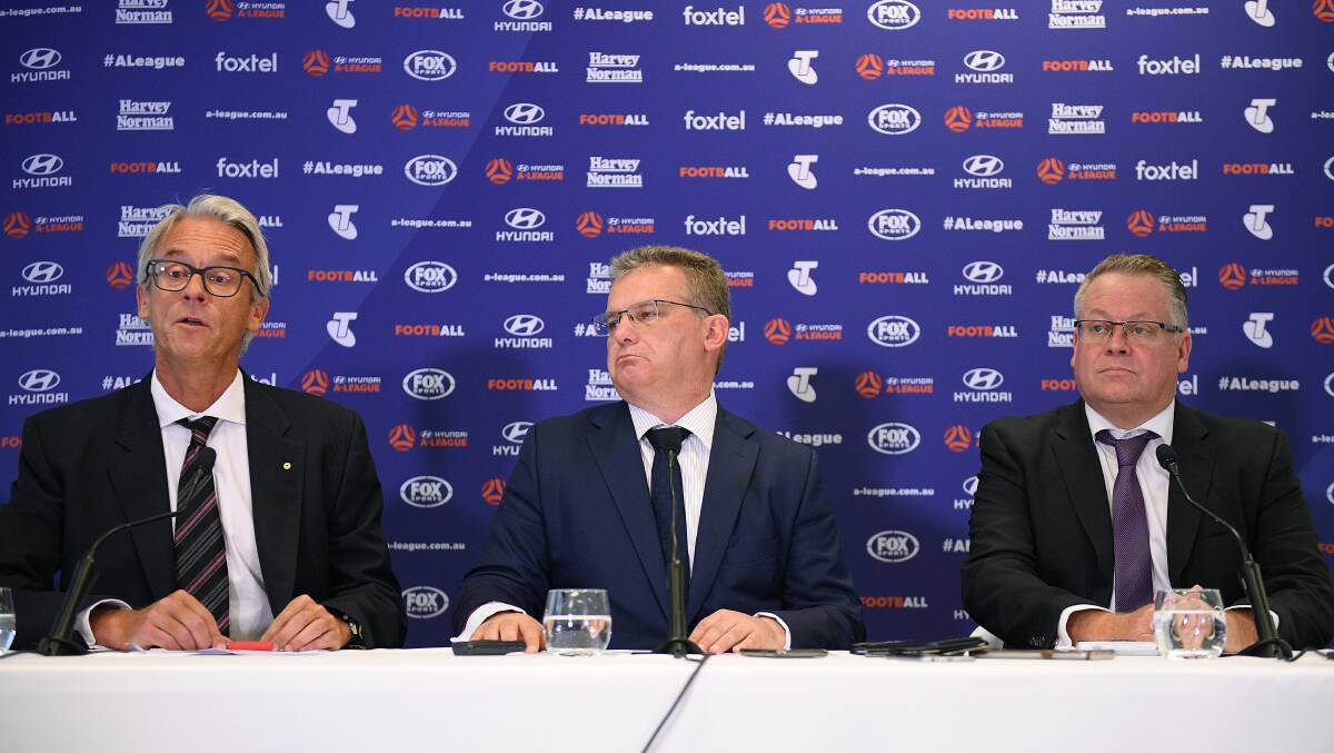 VERDICT: FFA CEO David Gallop, Chairman Chris Nikou and Head of Leagues Greg O'Rourke address media in Sydney regarding the A-League expansion. Picture: AAP Image/Dan Himbrechts