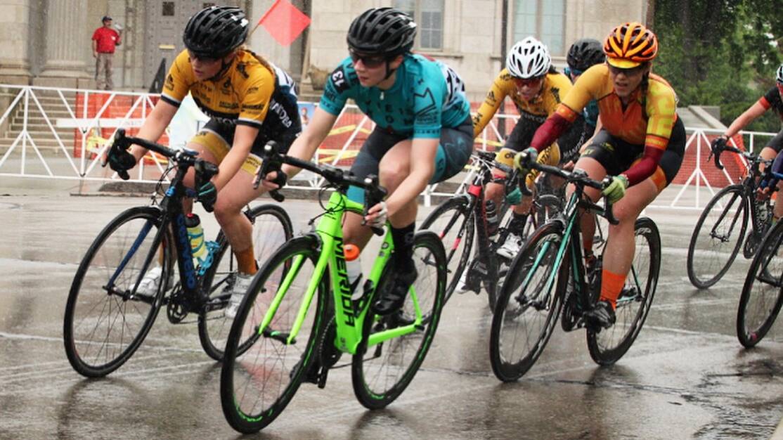 RACING HARD: Alice Debney (centre) bursts out of a corner during the Tour of America's Dairyland in the United States last month. Picture: Supplied