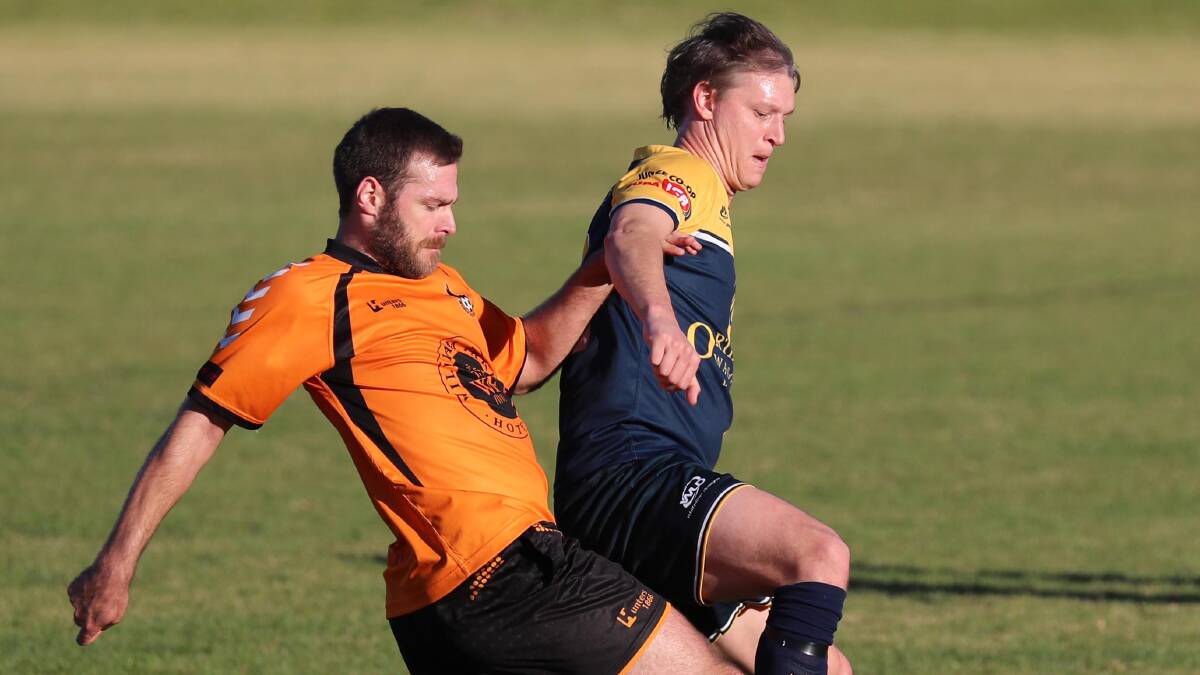 COLOUR SWAP: Junee's Adrian Merrigan (right) will don the orange strip next year after signing with Wagga United.