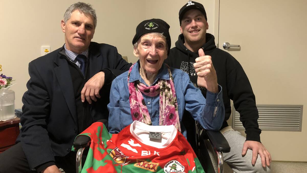 KITTED OUT: Kelly (centre) gives a thumbs up to Brothers coach Terry Westblade and hooker Aaron Wynne after receiving some fresh merchandise. Picture: Annie Lewis