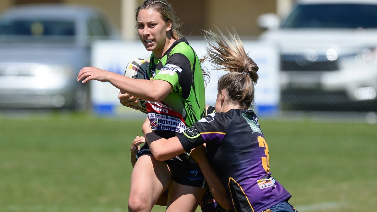 TACKLE TIME: Albury Thunder's Lauren Dam attempts to break a tackle against Central Storm during the Albury Thunder women’s 9’s tournament.