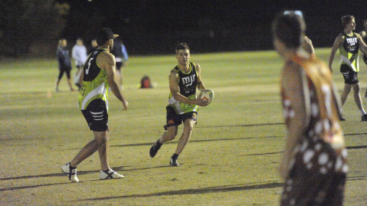 SEARCHING FOR A SPARK: MJR Electrics' Jesse Margosis tries to find space against Quolls during his side's 10-9 loss in the opening round of premier touch football. 