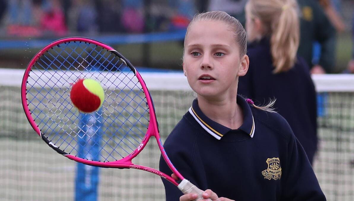EYES ON THE BALL: 10-year-old South Wagga Public School competitor Milla Pavitt gets her racquet up for a volley during the Todd Woodbridge Cup last week. Picture: Les Smith