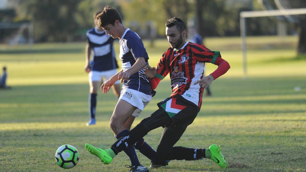 CHALLENGE: Young's Patrick Hislop outpaces Lake Albert's Fred Gardner during a Pascoe Cup fixture last year. The two sides played out a 0-0 draw on Saturday night. 