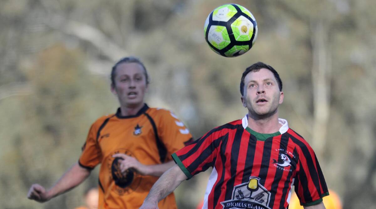 ALL SQUARE: Lake Albert's Jarrod Eaton and Wagga United's Ben Smith in action during their 1-all draw last weekend. 