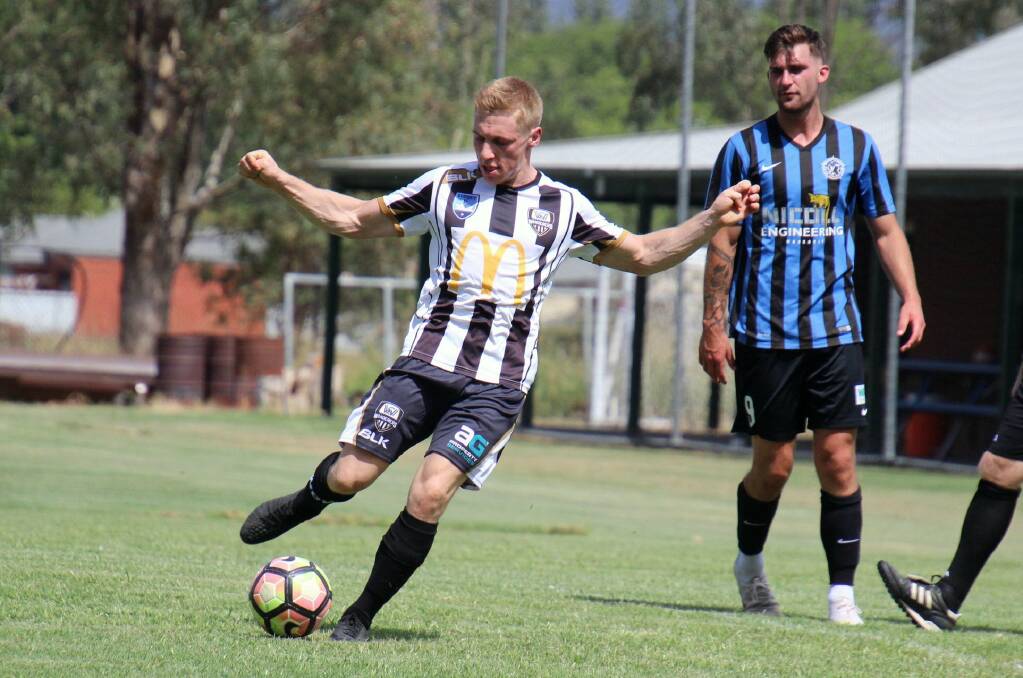 CENTRE OF ATTENTION: Midfielder Andy Gamble (left) impressed for Wanderers in their opening trial of the year. Picture: Gasperwatty Photography