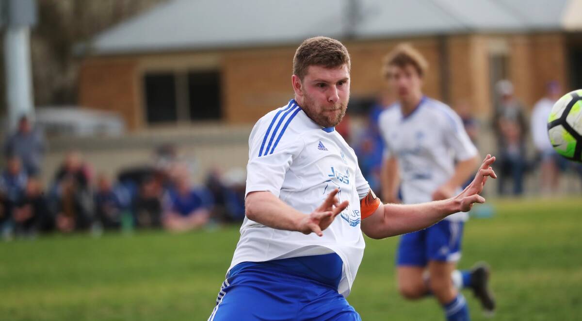 PRESSURE: Tolland skipper Richard Skidmore in action against Wagga United. Picture: Emma Hillier