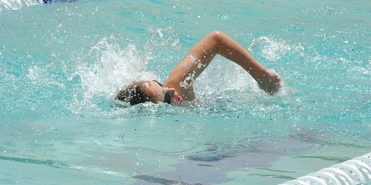 SURGING AHEAD: Jireh Sutton, 11, powers through the water during the senior boys relay at Oasis Regional Aquatic Centre.