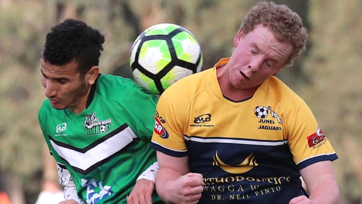 ONE ON ONE: Faisal Suleiman contests for the ball with Junee's Ben Cook during South Wagga's 2-0 win at Rawlings Park.