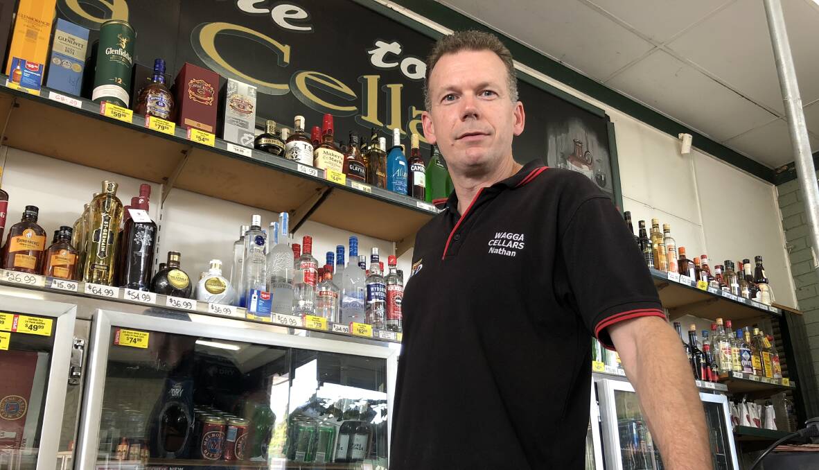 CHRISTMAS 'UNAFFECTED': Lake Albert bottle shop owner Nathan Hale believes Wagga residents won't stop purchasing alcohol over December despite rising costs.