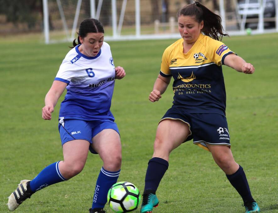 IN THE MIDDLE: Meg Thompson (Tolland) and Abbey Foley (Junee) go hard at the ball during a Leonard Cup clash earlier this year. Picture: Les Smith