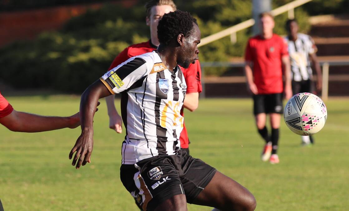 INJURED: Daniel Okot was forced off during the Wanderers 3-0 loss to Bankstown FC on Saturday. 