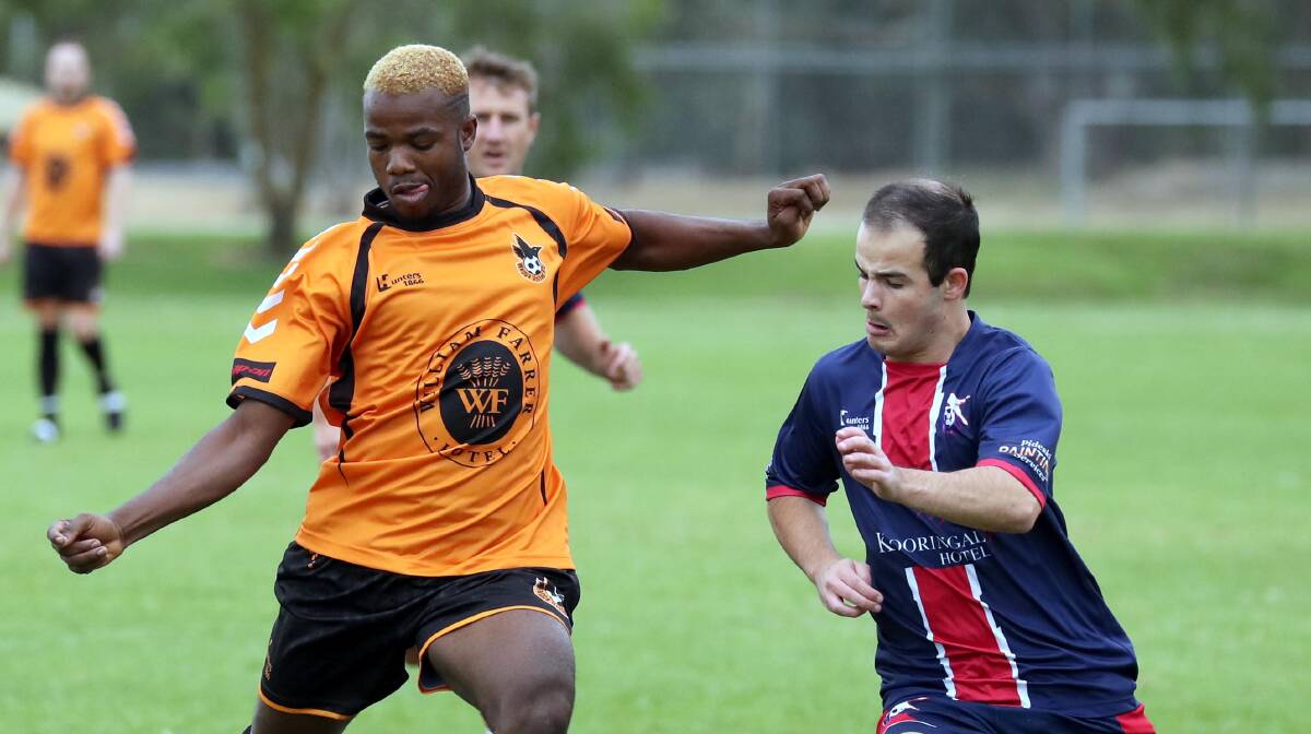 PICTURE OF CONCENTRATION: Prince Thompson prepares to clear the ball for Wagga United against Henwood Park.