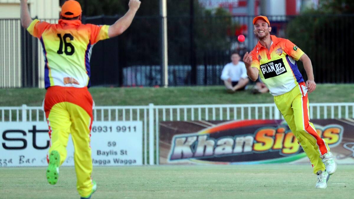YOU BEAUTY: Border's Cameron Suidgeest (right) celebrates after taking a screamer to dismiss Wagga's Aaron Maxwell. 