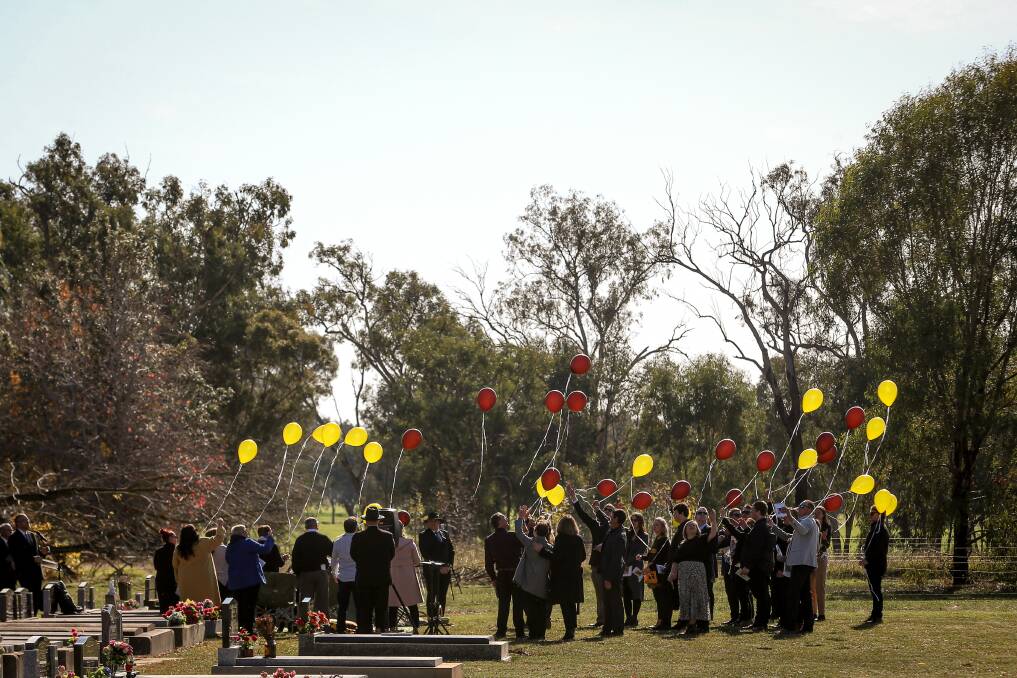 FOOTY FAN: Brown and gold balloons were released into the sky and the Hawthorn club song played at the conclusion of the service. Picture: JAMES WILTSHIRE