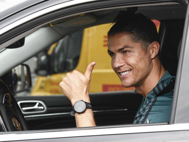 Cristiano Ronaldo gives the thumbs up after returning to training with Juventus.