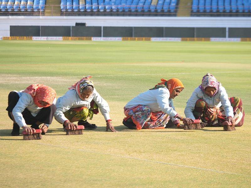 The Aussies arrived to Rajkot's new venue to the sight of four women scrubbing the pitch.