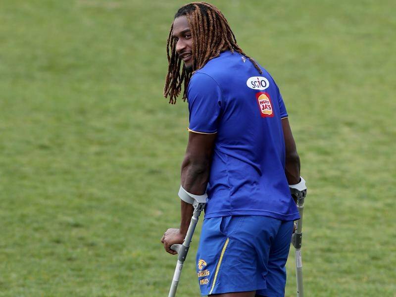Nic Naitanui, pictured with crutches at West Coast Eagles training, in August 2018 is set to return.