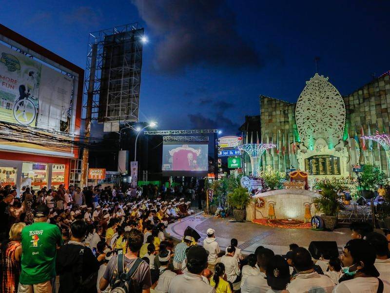 DFAT is "deeply disappointed" the graphic footage was played at the commemorative event in Bali. (Putu Sayoga/AAP PHOTOS)