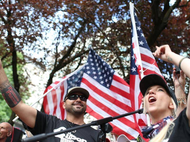 Joey Gibson (L), leader of Patriot Prayer, said the man shot in Portland was one of his members.