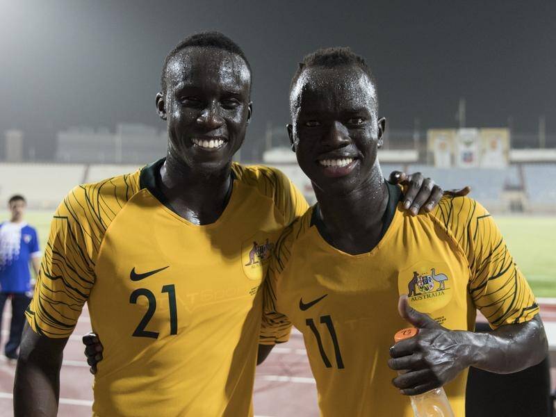 Thomas Deng (l) and Awer Mabil have opened sporting doors for African-born sportsmen in Australia.