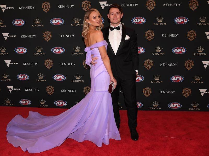 Brisbane's Lachie Neale and wife Julie on the red carpet at the Brownlow Medal awards.
