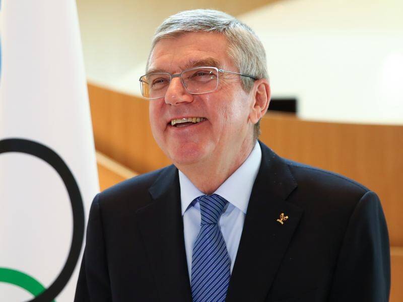 IOC boss Thomas Bach says the Tokyo Olympics in 2021 will be the light at the end of the tunnel.