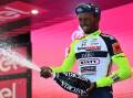Eritrea's Biniam Girmay celebrates on the podium after winning the 10th stage of the Giro D'Italia.