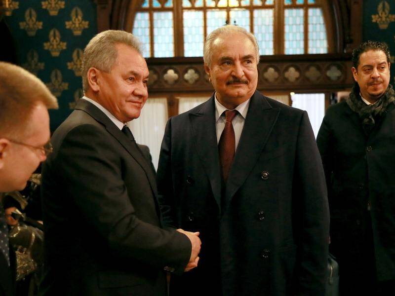 Libyan National leader Khalifa Haftar (c) with Russian Defence Minister Sergei Shoigu at the talks.