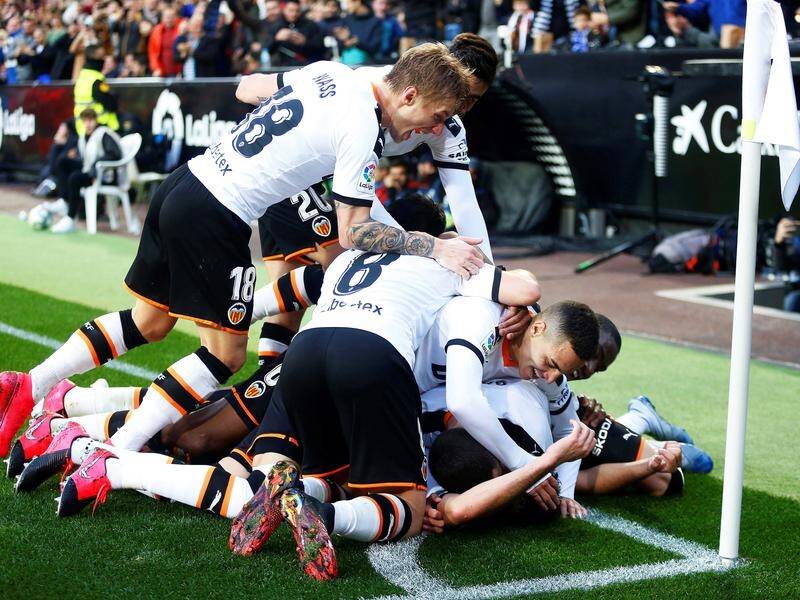 Valencia remain unbeaten at home this season after a 2-0 win over Barcelona in La Liga.