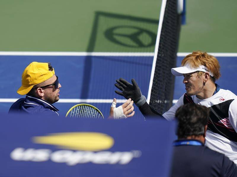 Australia's Dylan Alcott (l) shakes hands with Koji Sugeno after his win at the US Open.