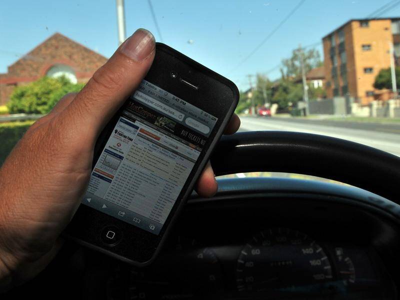Over 3300 people have been seen holdng a mobile phones while driving a vehicle in NSW in one week.