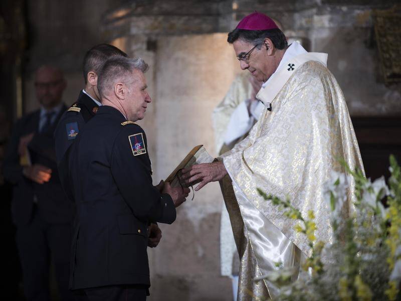 A Bible saved from the Notre-Dame fire has been given to the firefighters who saved the cathedral.