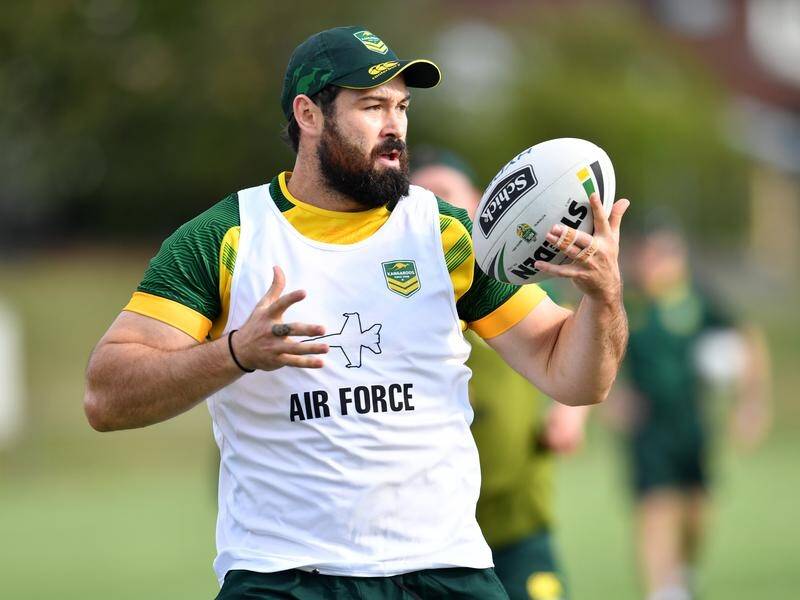 Aaron Woods is intent on keeping his Kangaroos jumper after being dropped from the NSW Origin team.
